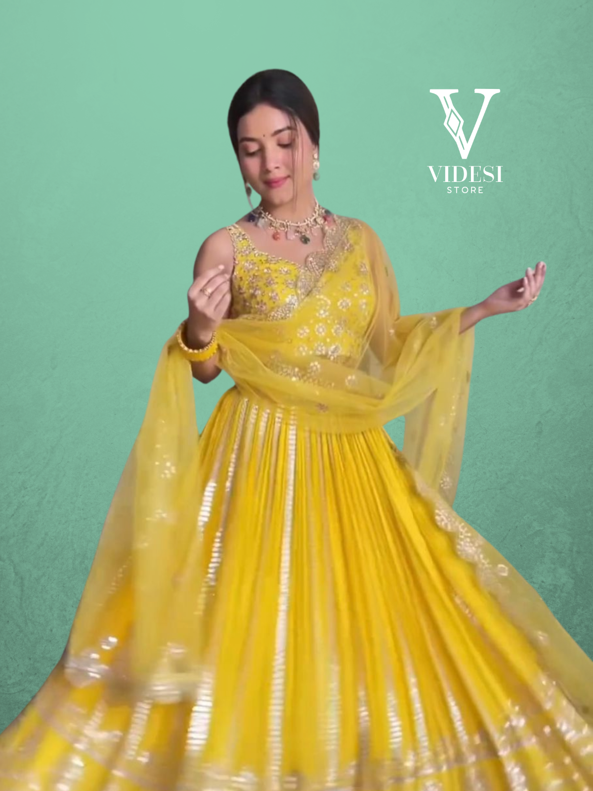 Amaji Vibrant Yellow Georgette Embroidered Sequined Lehenga